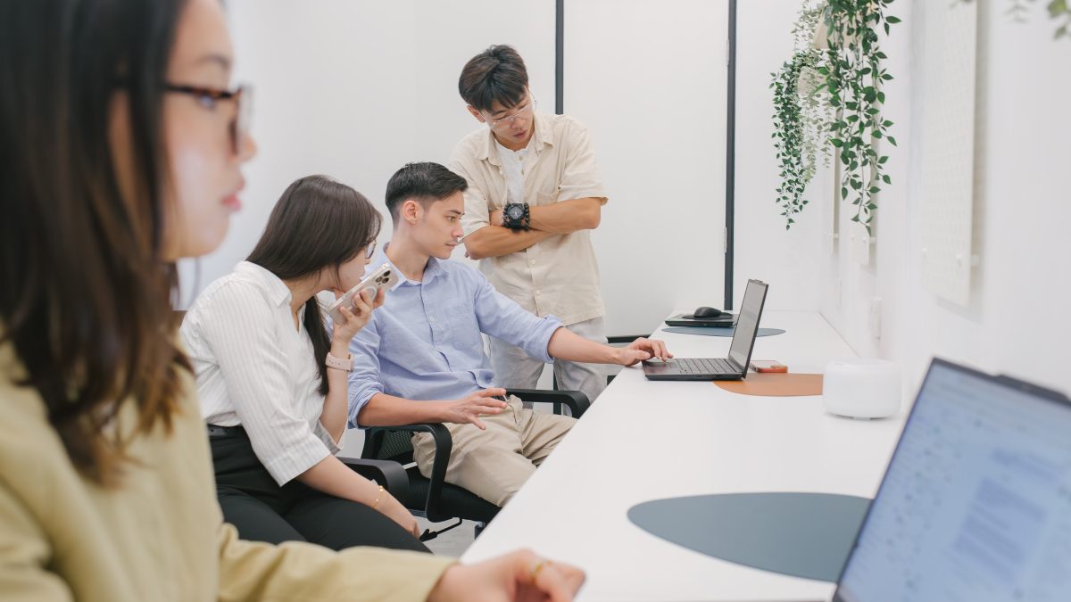 a-group-of-coworkers-discussing-at-office