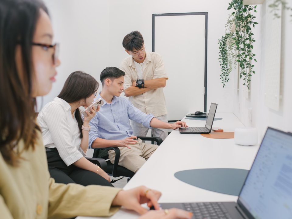 a-group-of-coworkers-discussing-at-office