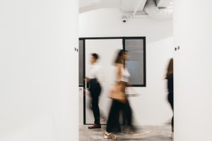 coworkers-walking-through-the-corridor